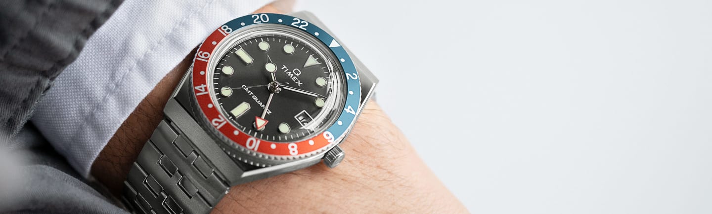 Q Timex GMT Stainless Steel Bracelet Watch.